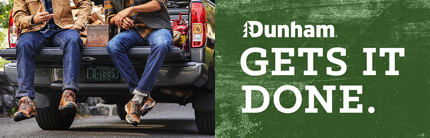 Men wearing Dunham boots on the back of a pick-up truck